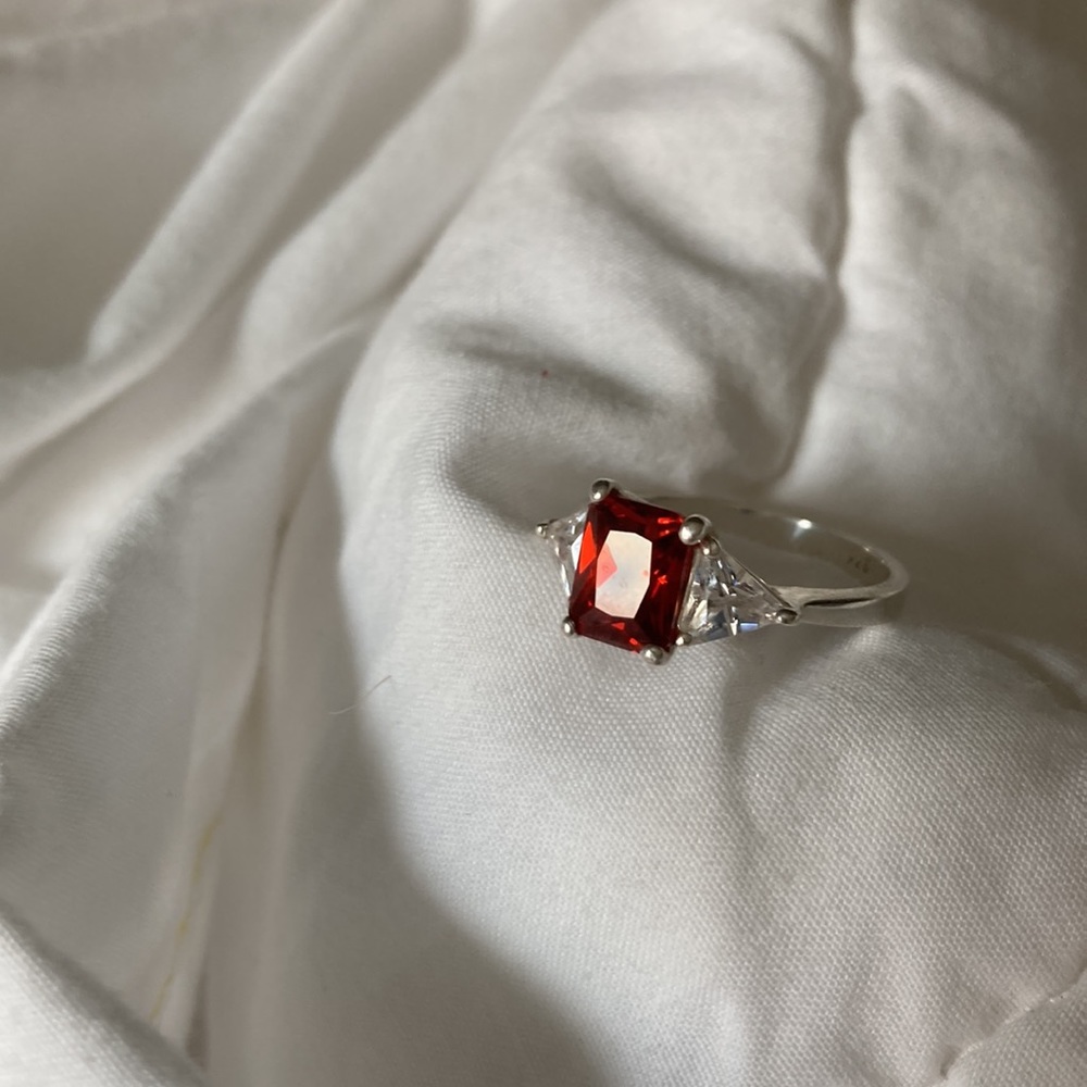Garnet and white topaz ring